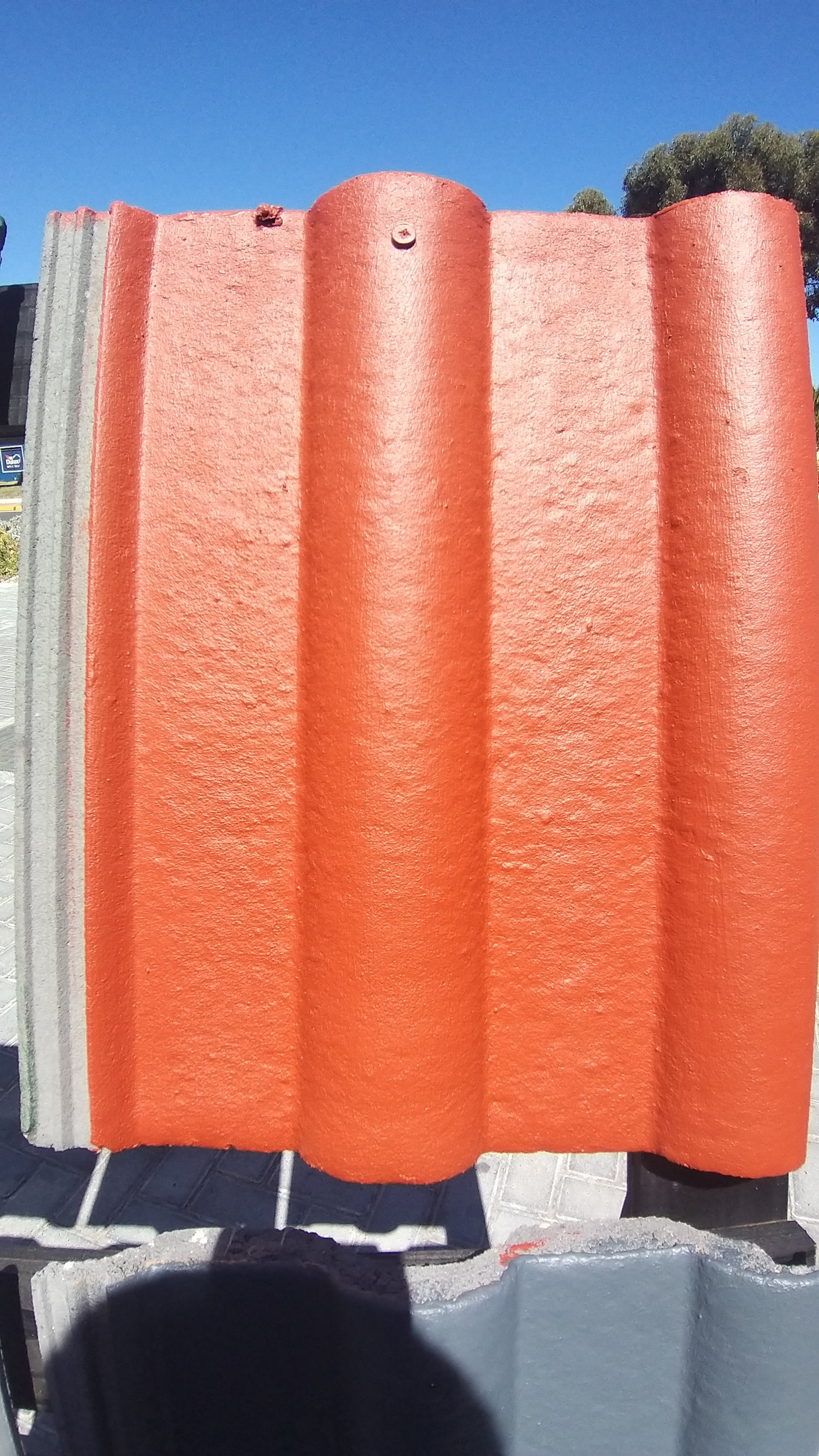 Roof tile painted with Red Oxide Rhinoluxe Shield waterproof paint