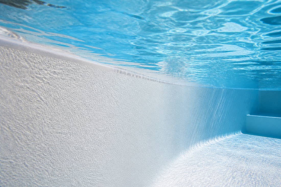 Smooth freshly painted white marbelite pool interior surface