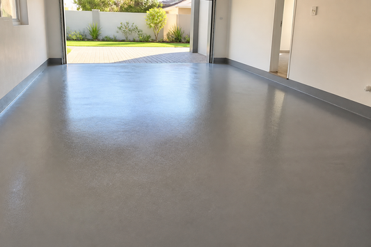 Freshly painted glossy grey concrete garage floor in a South African home