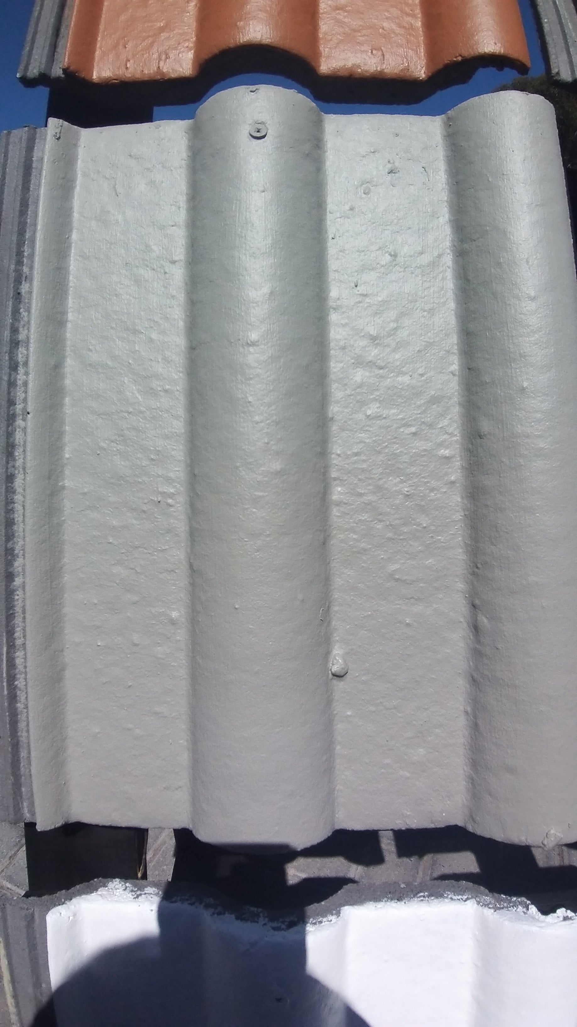 Roof Tile Painted with Rhinoluxe Shield in Cinder colour - waterproof paint for roofs