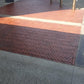 Stone Sealer applied to herringbone red paver entrance of shopping centre showing enhanced colour